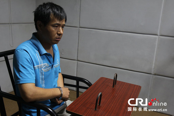 2014年7月13日，一名犯罪嫌疑人在接受采访。图片来源：李溱/CFP