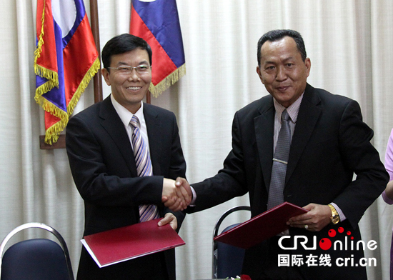 田玉红副台长和孙通社长交换协议　　