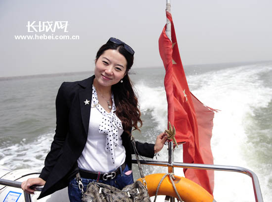 "我手里的海星很可爱吧."长城网 马冬冬 摄