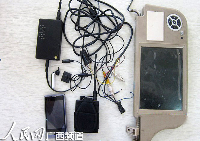 广西考生驾考作弊 纽扣处暗藏针孔摄像头(图)