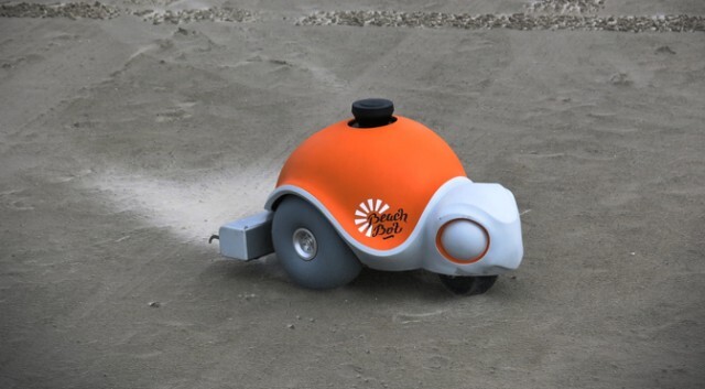 在沙滩上绘出巨大沙画 迪士尼沙画机器人面世